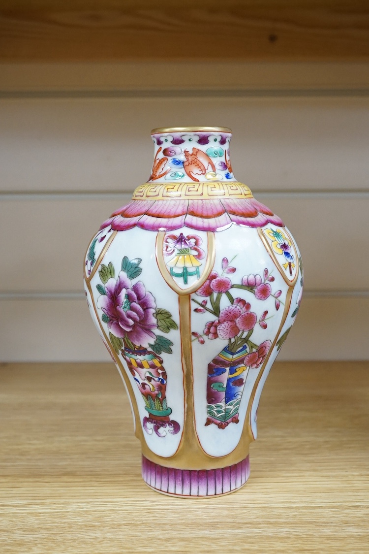 A Chinese famille rose vase enamelled with flowers, 20cm high. Condition - good